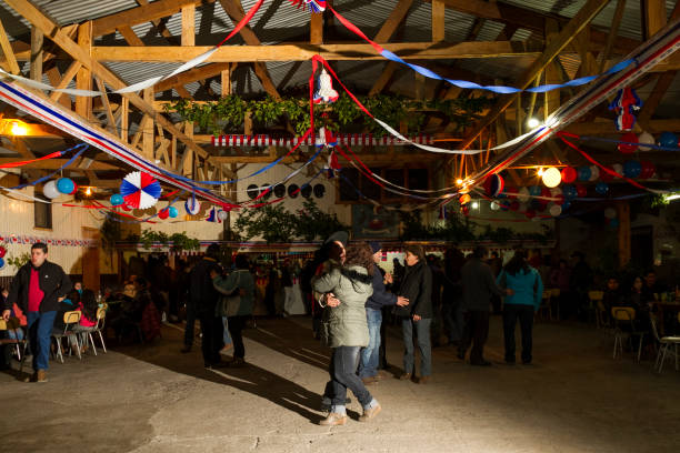 Celebrations of Chile's Independence Day Panguipulli, Chile - September 17, 2014: "Cueca" Chilean typical dance performed by a group of people in a National day on Chile in typical "ramadas", places made for this occasion. chilean ethnicity stock pictures, royalty-free photos & images