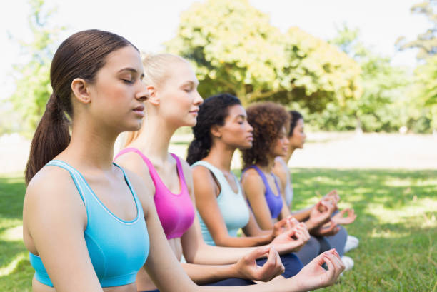 istock Friends meditating in lotus position 843498648