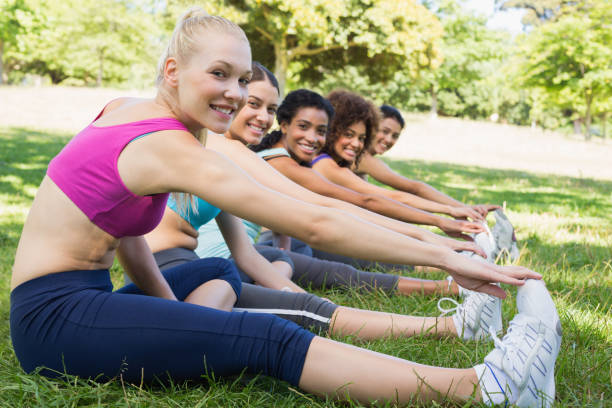 istock Women performing stretching exercise at park 843498728
