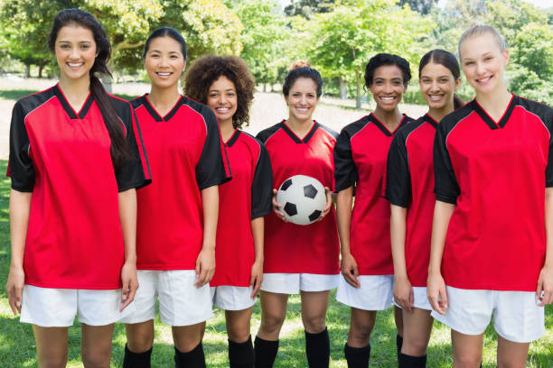 istock Happy female soccer team at park 843499468