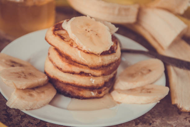 istock Pancakes with bananas and honey. Homemade breakfast 843505606