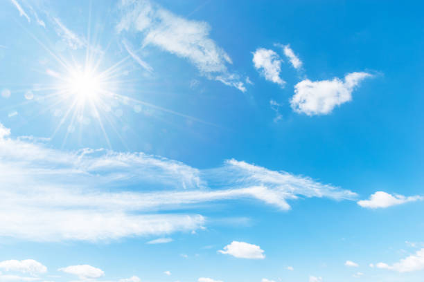 istock Blue sky background with the sun,Blue sky with white clouds floating in the sky. 843506306