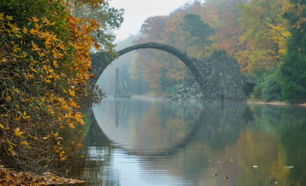 istock Devil's bridge in Kromlau in autumn coat 843509380