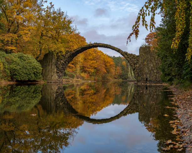 istock Devil's bridge in Kromlau in autumn coat 843509494