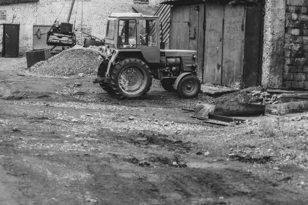istock an old tractor stands by the garage 843509514