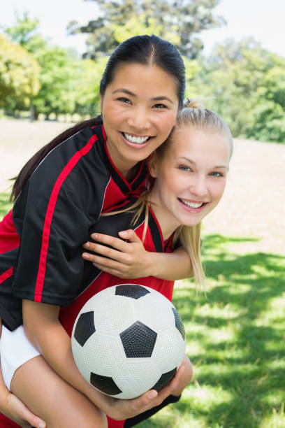 istock Female soccer player piggybacking teammate 843513926