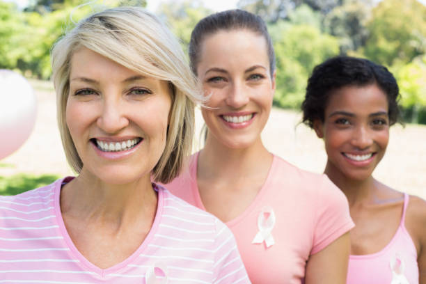istock Confident volunteers participating in breast cancer awareness 843514056