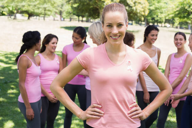 istock Female volunteer supporting breast cancer campaign 843514142