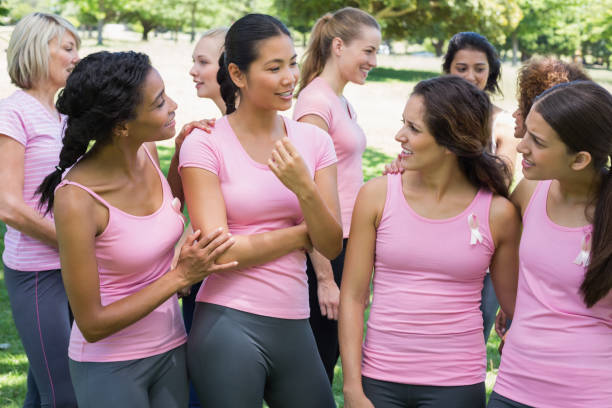 istock Volunteers discussing during breast cancer awareness 843514260