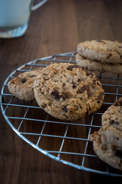 istock Chocolate cookies on wooden table. 843514590