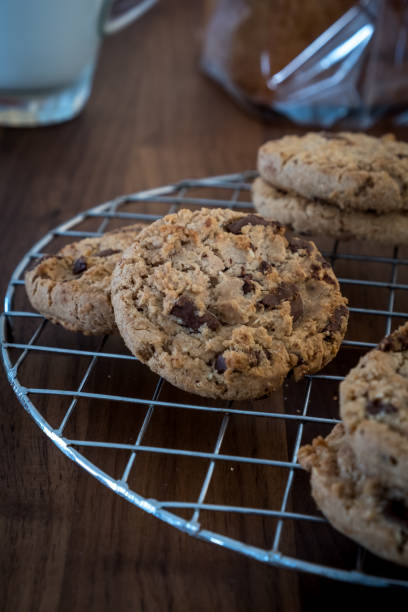 istock Chocolate cookies on wooden table. 843515134