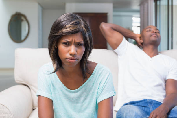 istock Unhappy couple not talking after argument on sofa 843517852