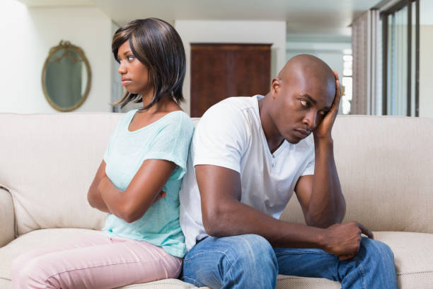istock Unhappy couple not talking after argument on sofa 843517920