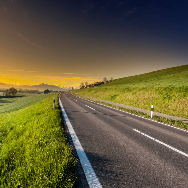 istock Asphalt road along the pasture 843522440