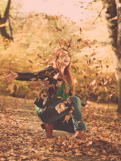 istock Female is playing with leaves. 843526004