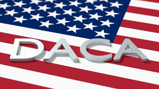 The word daca on an american flag immigration concept 3D illustration