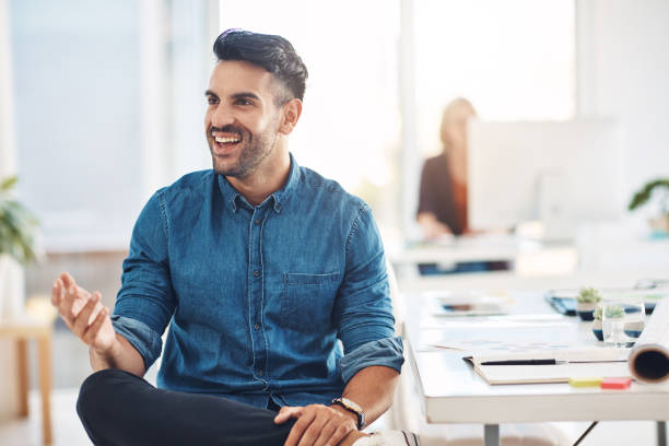 istock His positive attitude is great to have around the office 843530248