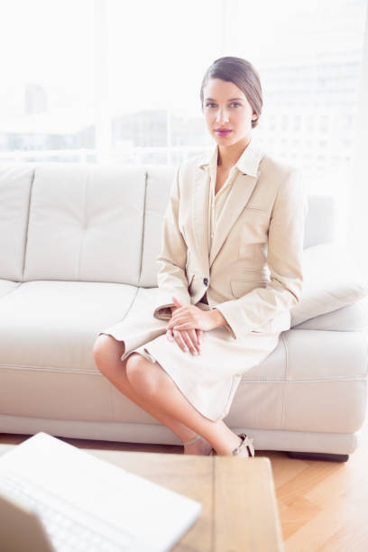istock Young businesswoman sitting on sofa 843532944