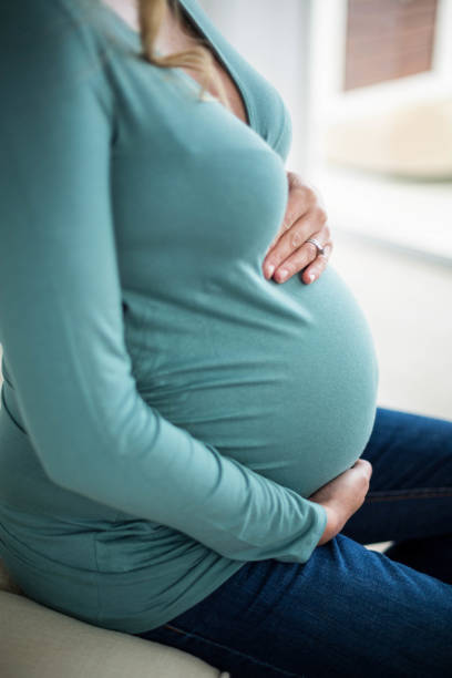 istock Pregnant woman touching her belly 843533288