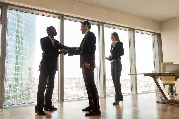 istock Boss shaking hand to new company worker in cabinet 843534006