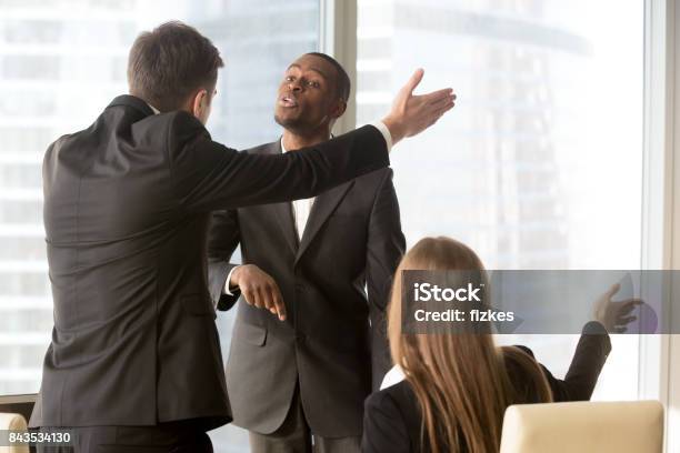 Annoyed Business Partners Arguing During Meeting Stock Photo - Download Image Now - Business, Conflict, Office