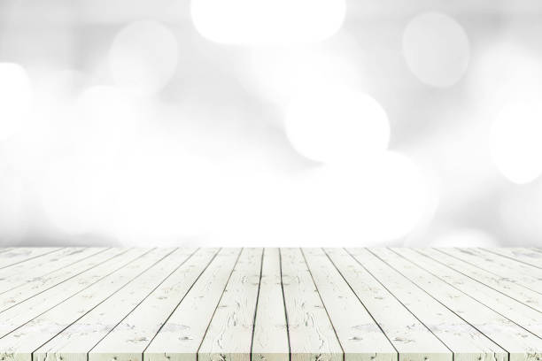 istock Perspective empty white wooden table on top over blur background, can be used mock up for montage products display or design layout. 843534606