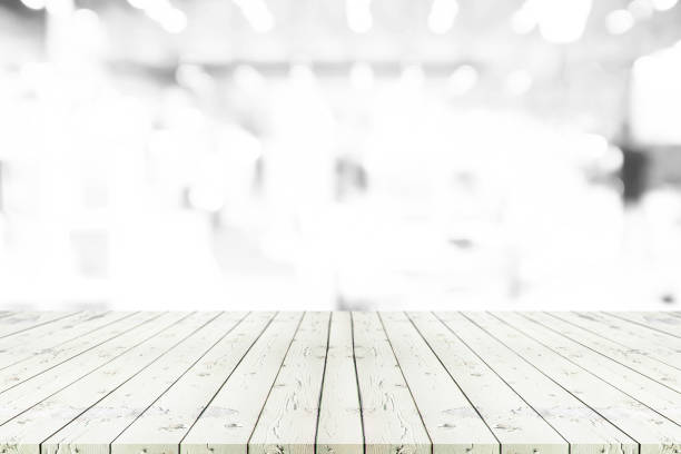 istock Perspective empty white wooden table on top over blur background, can be used mock up for montage products display or design layout. 843534610