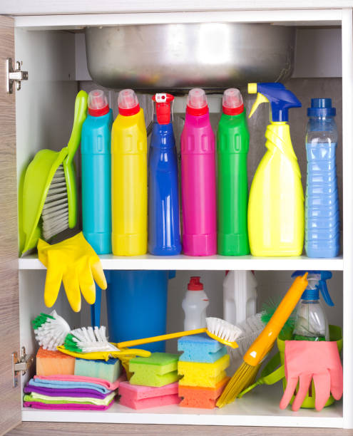 House cleaning concept Cleaning products placed in kitchen cabinet under sink. Housekeeping storage space cleaning cupboard stock pictures, royalty-free photos & images