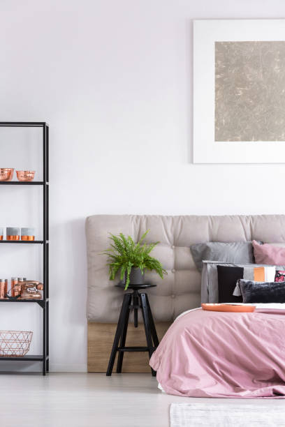 istock Stylish bedroom with black stool 843542552