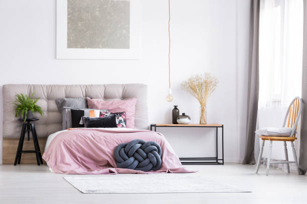 istock Trendy bedroom with orange chair 843542678