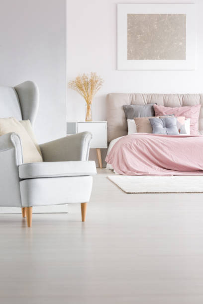 istock Grey armchair in trendy bedroom 843542684