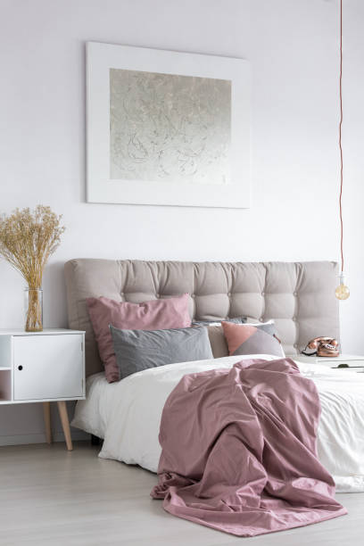 istock Pastel bedroom with grey painting 843542690