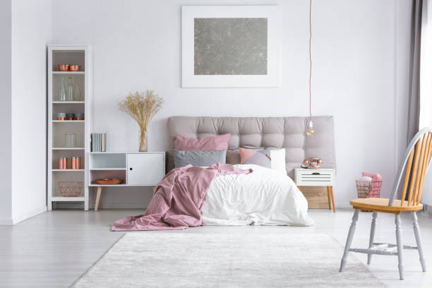 istock Orange chair in bright bedroom 843542738