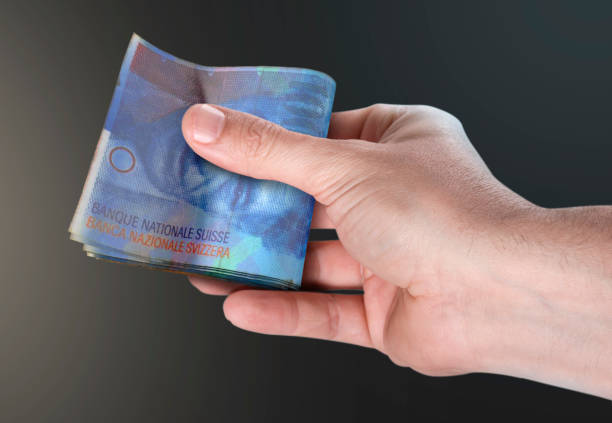istock Hand Passing Wad Of Cash 843543486