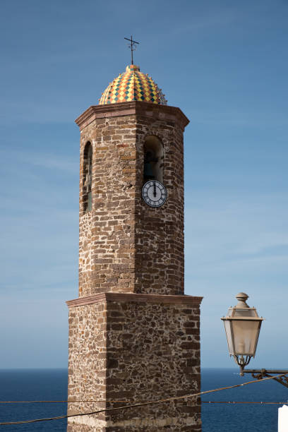 church bell and lamp Sant Antonio abate church bell tower in Castelsardo, Sardinia, Italy castelsardo photos stock pictures, royalty-free photos & images