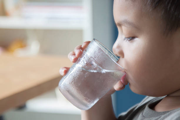 istock Children are drinking water in the morning. 843549530
