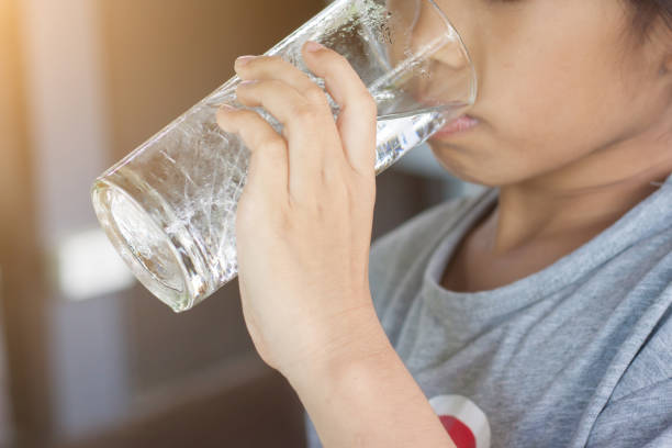 istock Children drink water in the morning. 843549608