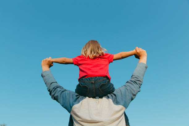 istock Father and little daughter play at sky 843550138