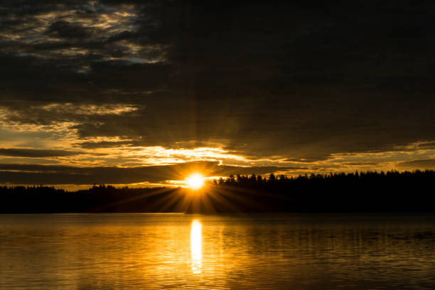istock Sunset sky background. Dramatic gold sunset sky with evening sky clouds over the sea. Stunning sky clouds in the sunset. Sky landscape. Panoramic sky view. 843550710