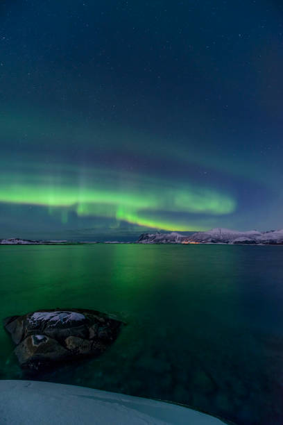istock Aurora Northern Polar light in night sky over Northern Norway 843557398