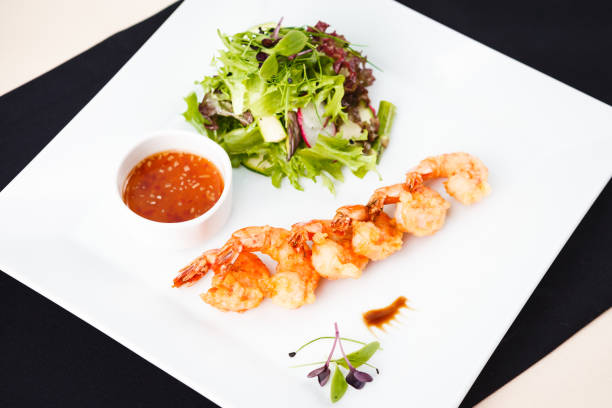 istock Tempura shrimps with salad 843560926