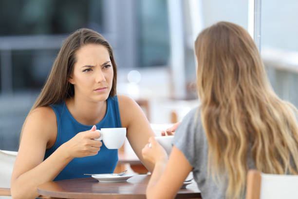 istock Serious friends having a conversation in a bar 843564212