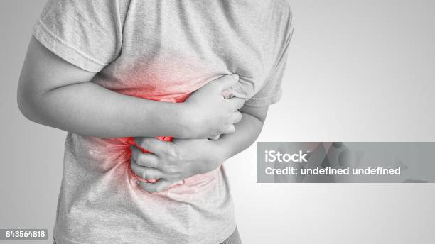 Asian Man Suffering From Stomachache Stock Photo - Download Image Now - Gastroesophageal Reflux Disease, Stomachache, Men