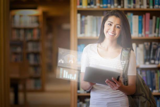 istock Smiling cute student working on her futuristic tablet pc 843564956