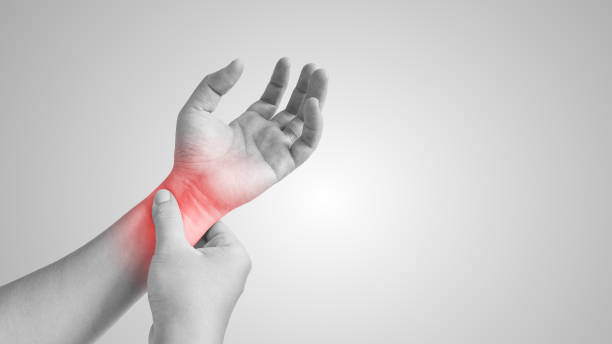 Asian man with painful and inflamed gout on his hand. Asian man with painful and inflamed gout on his hand around the thumb area. tropical fish closeup stock pictures, royalty-free photos & images