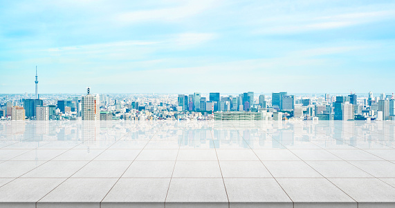 Business concept - Empty concrete floor top with panoramic modern cityscape building bird eye aerial view under sunrise and morning blue bright sky of Tokyo skytree, Japan for display or montage product