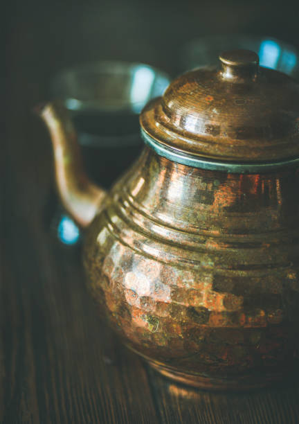 istock Oriental Middle Eastern tea pot and black tea in glasses 843565866