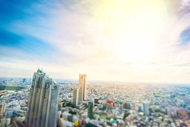 istock panoramic modern city skyline bird eye aerial view under dramatic sun and morning blue cloudy sky in Tokyo, Japan. Miniature Tilt-shift effect 843566434