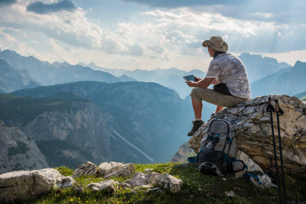 istock traveler with tablet in the mountains 843567288