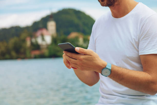 istock Modern guy using cellphone in the European city 843569568